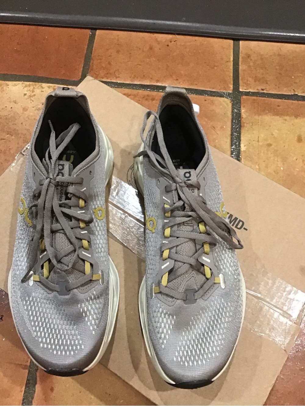 Men’s ON Cloudsurfer Max, size 10. The color is CINDER PELICAN not brown